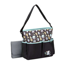 Monkey-print diaper tote with zip top, teal-lined pockets, black and patterned panel