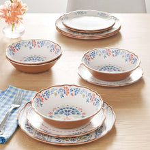 Stacked floral dinner bowls and plates, brown rim with blue and red flowers.
