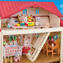 Interior view of dollhouse attic room with red roof, furniture, and small animal figures