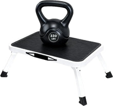 Foldable 1-step stool with black platform, carry handle, and 330 lb capacity label.