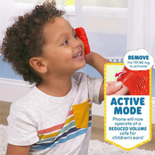 Red Elmo learning phone in packaging, orange nose and character keypad visible