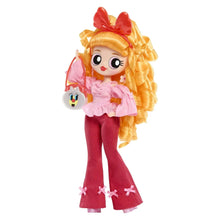 Blossom fashion doll wearing pink top and maroon pants with side bag accessory