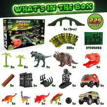 Dinosaur dash track set box contents with green tracks, dinosaur figures, and toy parts