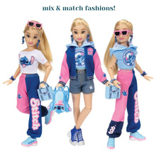 Disney Ily fashion doll wearing a white top, pink-and-blue pants, and sunglasses.