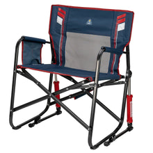 Oversized foldable rocking camp chair with blue back panel, red edging, black armrests