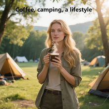 Woman holding a cup outdoors with coffee camping branding above