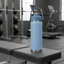 Light blue insulated chug water bottle with carry handle and metal base