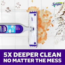 Power mop with purple reservoir and striped pad cleaning orange mess on tile