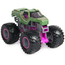 Green monster truck toy with purple roll-cage details and oversized treaded tires