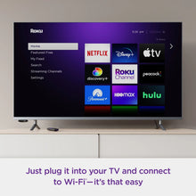 Smart TV displaying a streaming home menu with app tiles