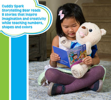 Plush storytelling bear hugged by a child while reading a blue storybook