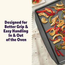 Rectangular non-stick baking tray with dark coating, showing baked slices inside.