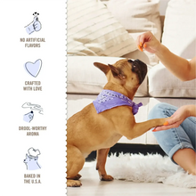 Dog treat offering: sandwich cookies labeled no artificial flavors, crafted with love