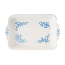 White rectangular baking dish with blue floral wreath design on front