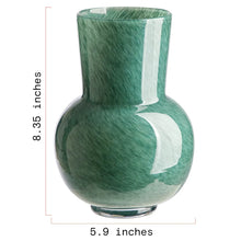 Green mottled glass vase with rounded bulb body and flared top