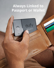 Black eufy Security smart tracker card clipped in leather wallet