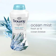 Downy Light in-wash scent booster beads bottle with Ocean Mist graphics.