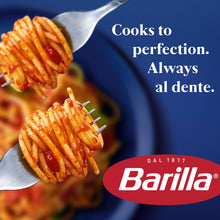 Forked cooked cellentani pasta in red sauce with Barilla logo