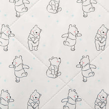 White plush changing pad cover with quilted diamond stitching and bear character print