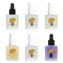 Set of nail care mini bottles with black droppers and gold elephant logo