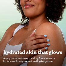 Woman applying body lotion to chest with blue-painted nails