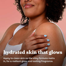 Person applying body lotion to shoulder with blue nail polish