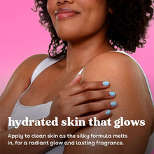 Woman applying body lotion with hand lotioning on shoulder, eos bottle out of frame