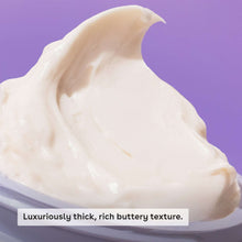 Thick white whipped body butter scoop on a spoon