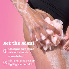 Body wash foam on leg with hands gently massaging thick lather.