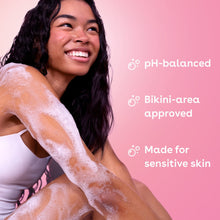 Person lathering cashmere body wash on skin with visible white foam.