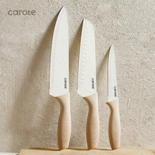 Ceramic kitchen knives with white blades and cream wooden handles, three-pack view