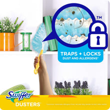 Cleaning duster and handle with blue fibers, traps and locks dust and allergens