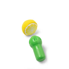 Pretend lemonade toy pieces: yellow lemon slice and green bottle-shaped cup