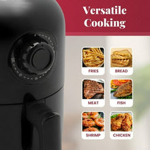 Compact black air fryer with control dial and side pull handle.