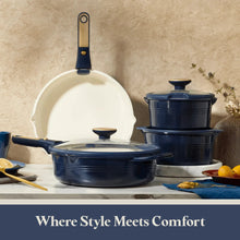Blue ceramic pot stack with lids and detachable handles on a kitchen counter.