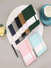 Green A7 pocket notebook with elastic closure strap and bookmark band