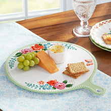 Mint green oval ceramic serving board with floral border and handle, pink and blue blooms
