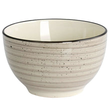 Cream stoneware bowl with speckled texture, glossy finish, and thin black rim