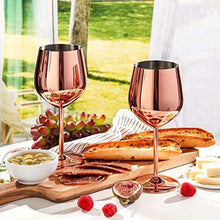 Rose gold metal stemmed wine glasses with smooth bowls and sturdy bases