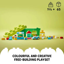 Mini LEGO DUPLO buildings and colorful bricks arranged on a play surface