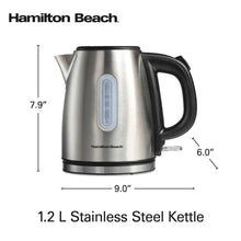 Stainless steel electric kettle on display with black handle and water level window