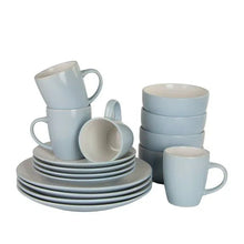 Two-tone coupe dinnerware set with stacked plates, light blue mugs, and bowls