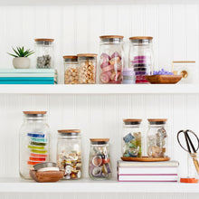 Ball wide-mouth mason jars with metal lids and bands, clear glass, filled varieties.