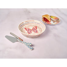 Stoneware pie dish with butterfly pattern, plus matching small plate and utensils
