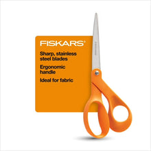 Fiskars orange-handled scissors with silver blades, shown next to an orange label.