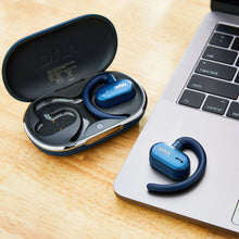 Blue wireless open-ear earphones with open charging case and a single earbud shown