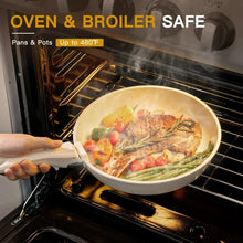 Cream white oven-safe sauté pan with vegetables and meat cooking inside