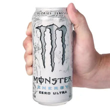 Zero Ultra energy drink can held in hand, white with black Monster drip logo