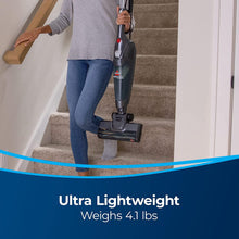 Lightweight upright vacuum with motorized floor head on carpeted stairs