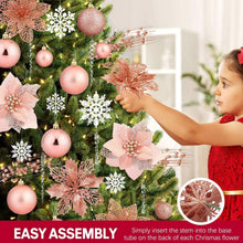 Tree ornaments: pink glitter baubles, white snowflakes, and hanging icicle drop chains